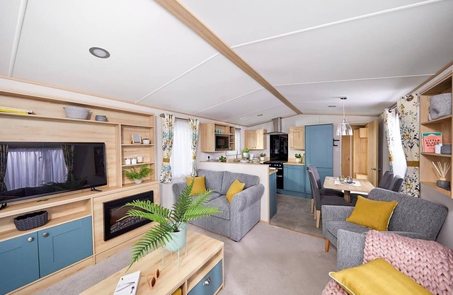 Spacious and modern 12ft-wide caravan with one double and two twin.