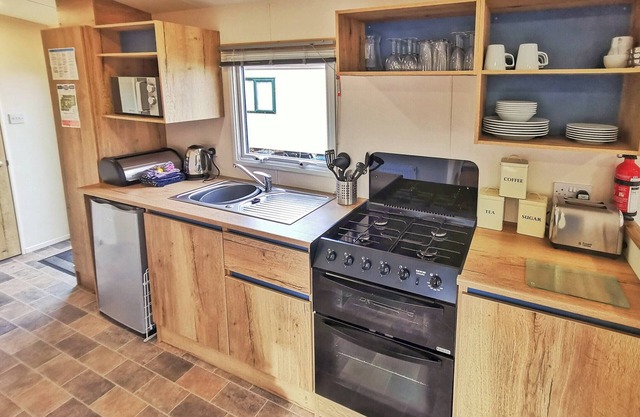 Spacious and well presented 12ft wide caravan with one double and two twin.