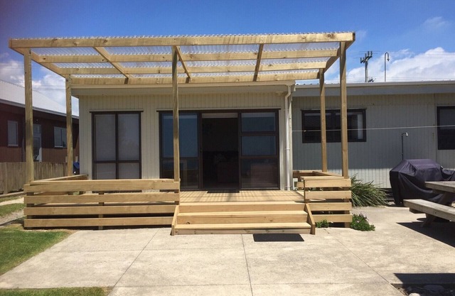 Spacious Beachfront Family Bach with extra studio