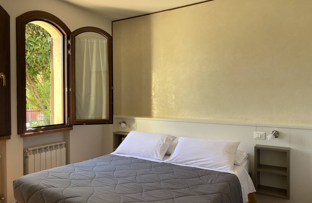 Spacious JOLLY three-room apartment equipped with all comforts, with garden and terrace.