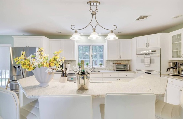 Spacious luxury home with a large private backyard, seasonal in-ground pool, and year-round sauna an
