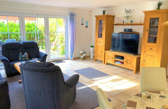 Spacious vacation home close to the beach in Norddeich with garage, terrace and beach chair