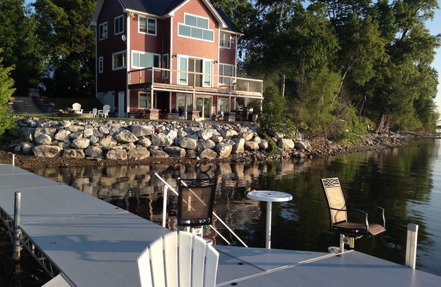 Spectacular Lakefront Home With Patio, Fire Pit, Large Dock and Work Booth.