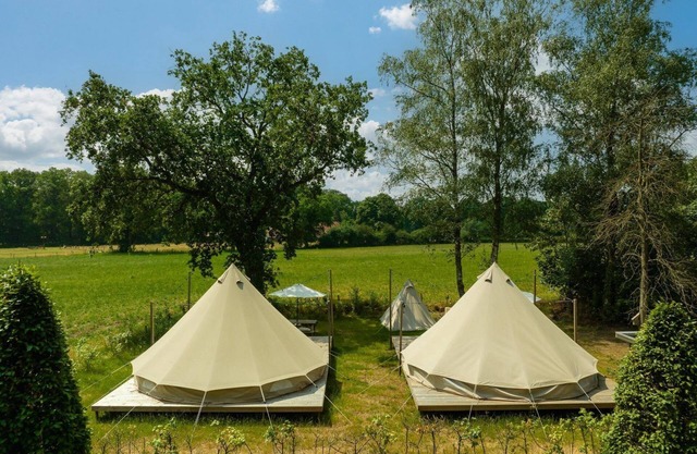 Spend the night in a cozy bell tent overlooking the meadows!