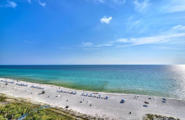 Sprawling, waterfront condo w/balcony views plus a shared hot tub, pool, & gym