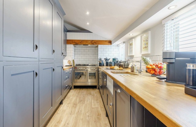 Standing in it’s own beautiful grounds, with private garden and hot tub overlooking the waters.