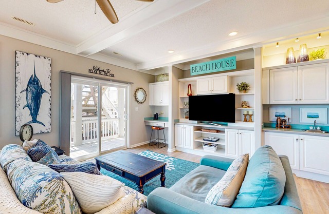 Stay steps from the sand with pool, tennis court, furnished deck, & jetted tub