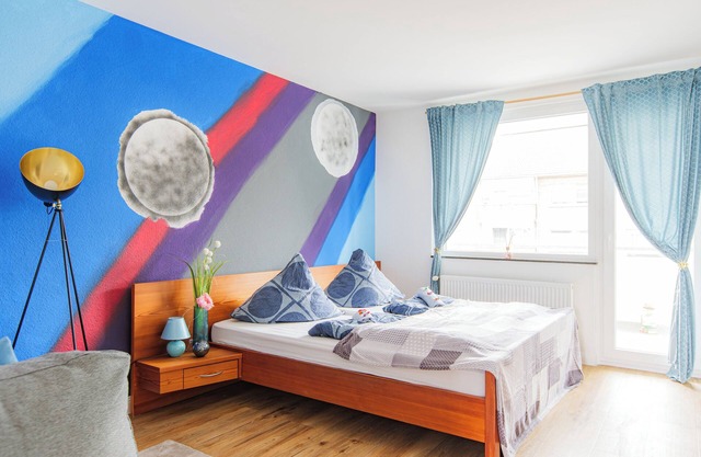 - Stellar Haven Deluxe with Cosmic Design - 3-Room Space-Themed Apartment 75 qm-