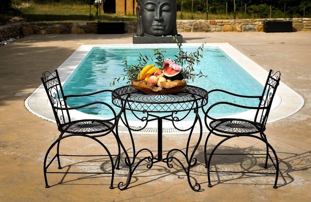 Stone farmhouse with pool.