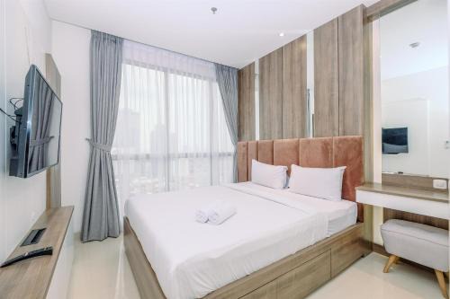 Stunning and Cozy 1BR Apartment at Ciputra World 2 By Travelio