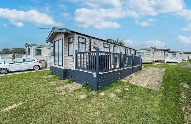 Stunning caravan with side decking just a short walk to Hembsy beach ref 00069BA