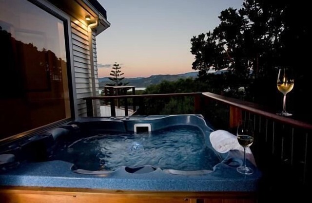 Stunning self-contained hillside retreat with unsurpassed harbour views