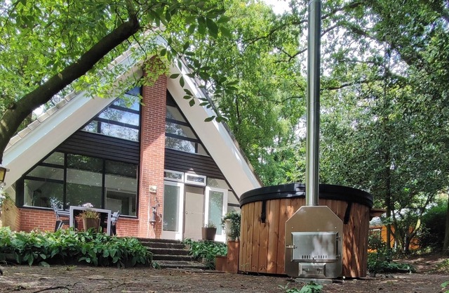 Stylish holiday home in the forest and near De Groote Peel Limburg National Park