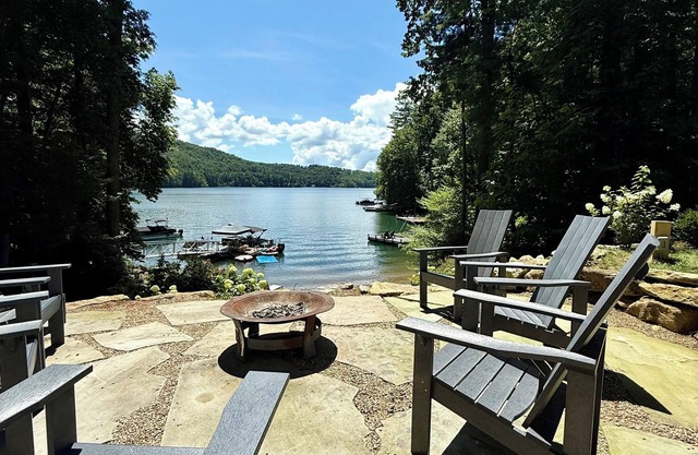 Stylish lakefront home with large flat yard, boat dock, hot tub & mountain view!