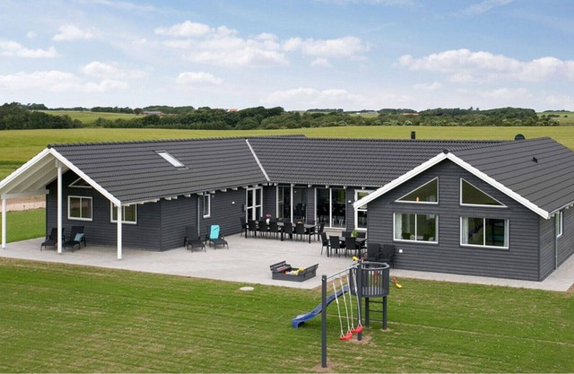 Stylish pool holiday home with activity room located on the idyllic Limfjord