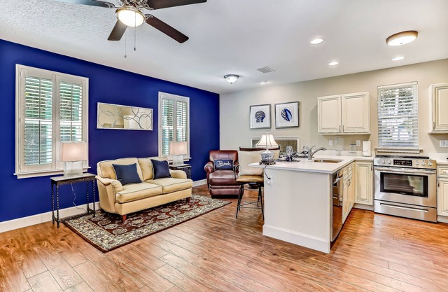 Stylish & sun-filled retreat with large patio & fireplace - near beaches & golf