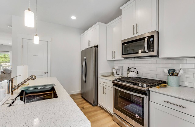 Stylish, two-story home with a washer/dryer & furnished porch - dogs welcome