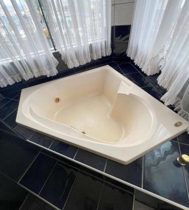 Suíte de luxo no centro com closet e hidromassagem