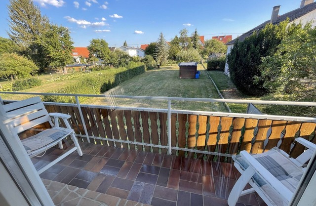 Sunny 3-room apartment with balcony surrounded by greenery