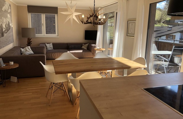 Sunny, modern mountain apartment with large balcony facing south-west centrally