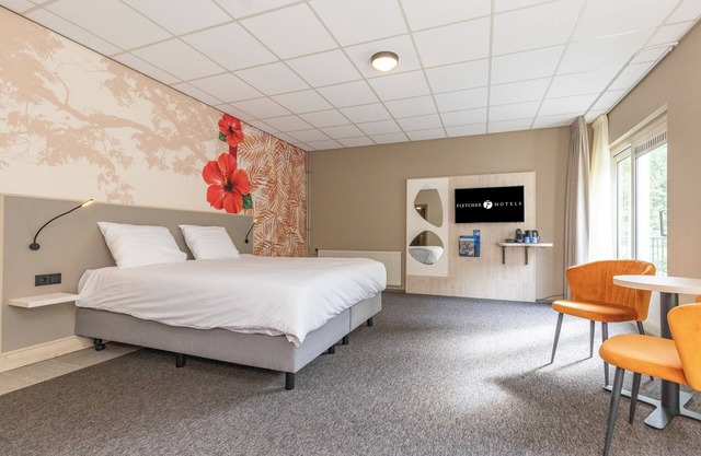 Swim and Stay — Indoor Pool, Free Parking, and Great Games Right Inside