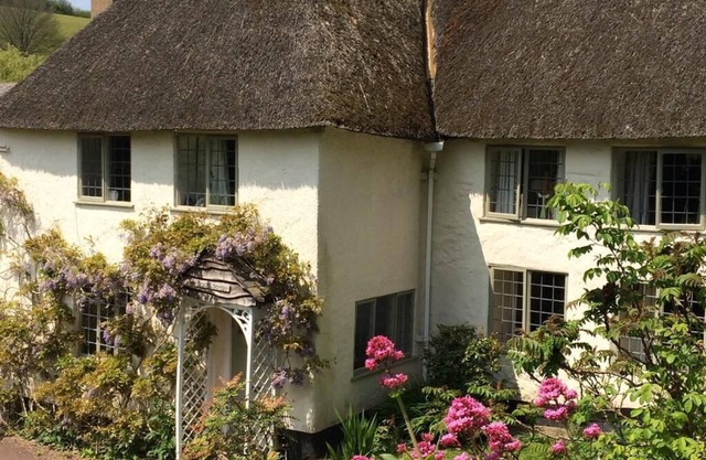 Thatched Devon longhouse, close to sea, with private indoor swimming pool.