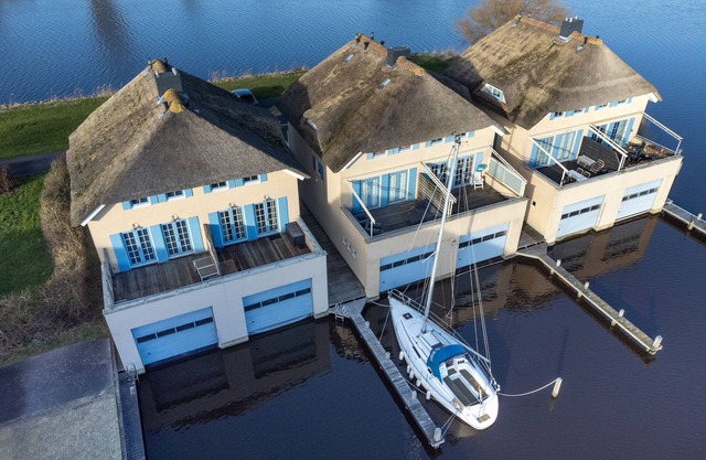 Thatched house with water views