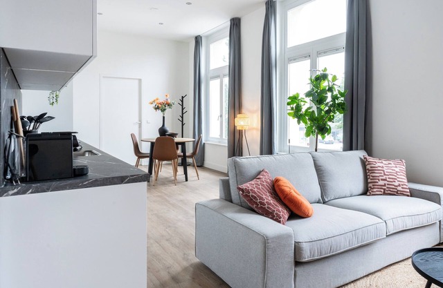 The apartment features a luxuriously furnished bedroom. New Studio Apartment with Shared garden.