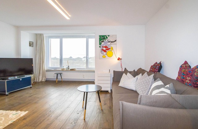The apartment offers about 90 square meters for up to 4 people.