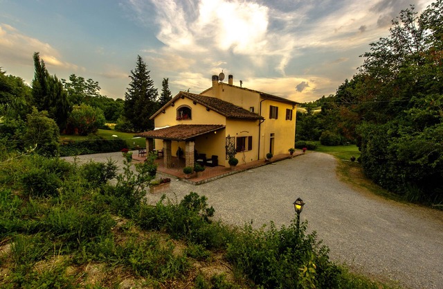 The country house in the middle of a small green valey