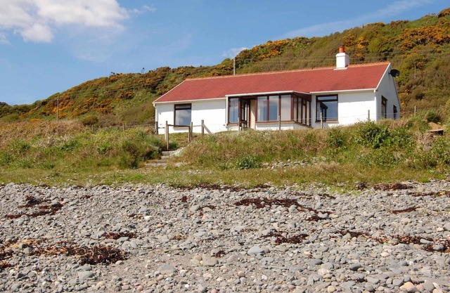 The Haven nestling in an idyllic setting on the shore of Luce Bay in Galloway a