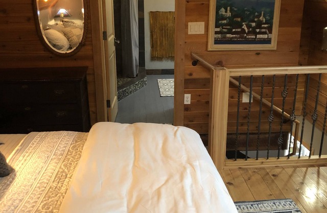 The Loft King Room w/full kitchen in historic Carriage House building.