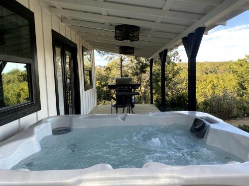 The Ultimate Romantic Getaway: Charming Cabin with a Hot Tub in Wimberley, Texas