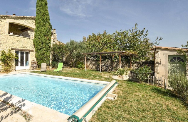 This beautiful and spacious stone vacation home welcomes you on a large and wooded property.