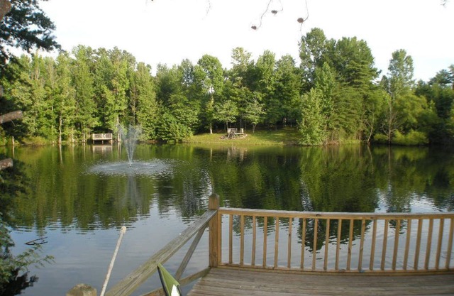 This charming cozy cottage has a private hot tub, deck for fishing.