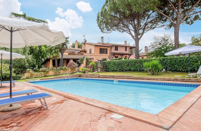 This classically furnished vacation home impresses with its outdoor areas.