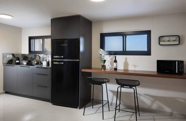 This cozy apartment offers ample space, featuring a comfortable living room perfect for relaxation