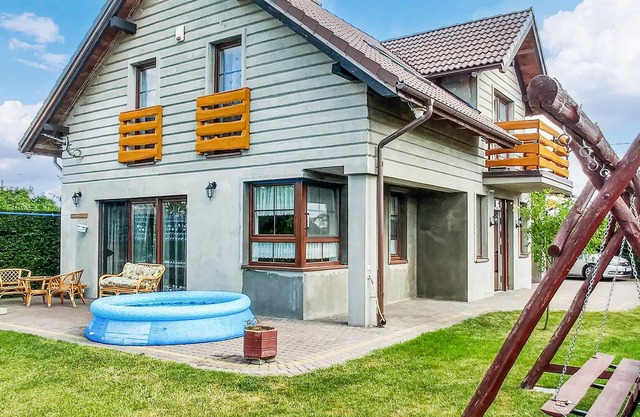 This modern vacation home is located in the northeast of Poland with a garden, playroom and family-f