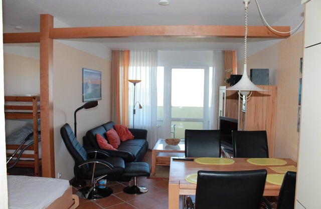 This west-facing apartment with 40 m&sup2; of living space is located on the 5th floor of Haus Eckernförde. A large cupboard bed and a bunk bed in the separate bedroom offer space for a maximum of 4 people. The fitted kitchen is completely.