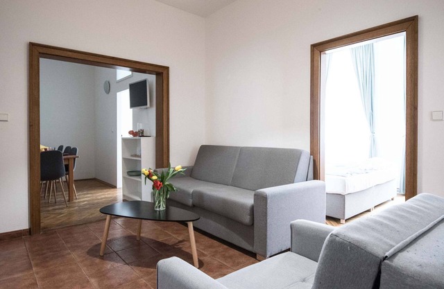 Three bedroom duplex apartment with small dining room, small living room and kitchen