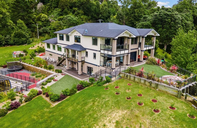 Three levels and home with covered swimming pool,tennis court,gym and games room