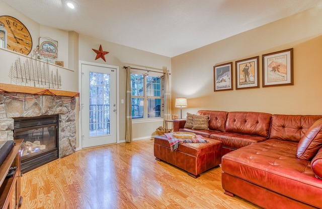 Three-story retreat with a gas fireplace plus access to pool, hot tub, & sauna