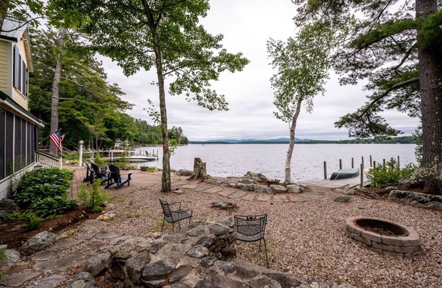 Timeless lakefront home on Lake Winnipesaukee with screened-in porch and dock