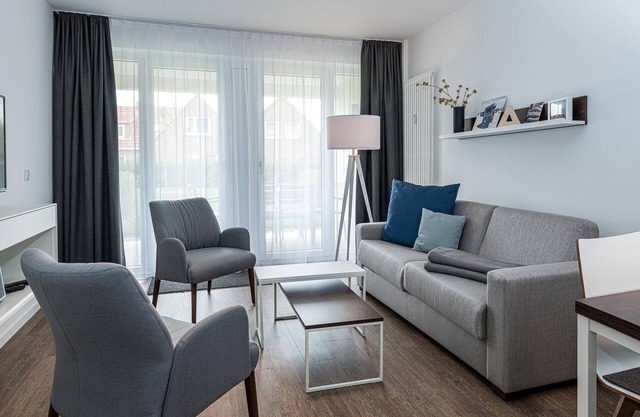 Top-ferienapartment mit Großer Terrasse, Parkplatz, Schwimmbad- & Saunanutzung
