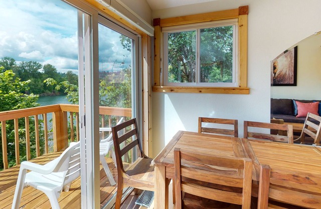 Top-floor of riverfront home w/ wraparound deck, free WiFi, & great location