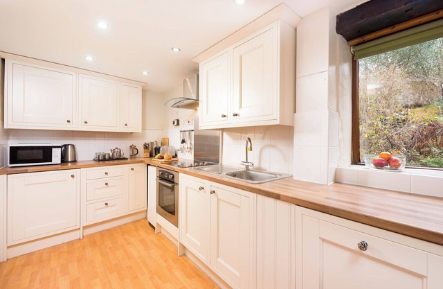 Traditional Byre Barn conversion with balcony off bedroom view North Devon Farm