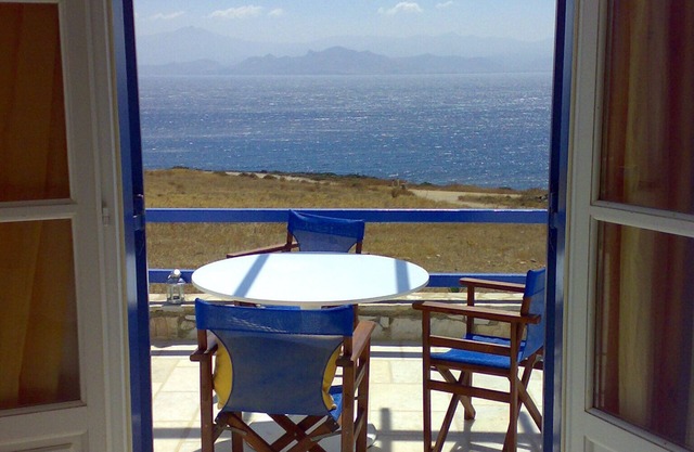 Traditional Cycladic house with view to the deep blue