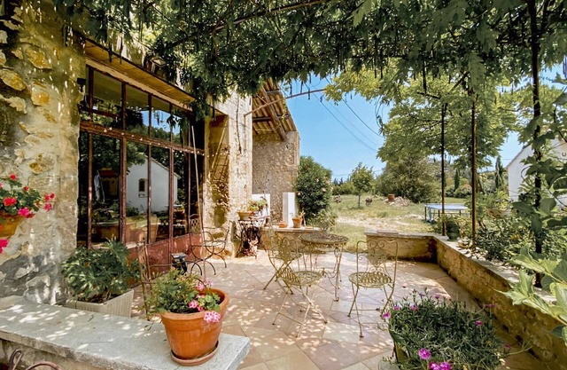 Traditional farmhouse with charm and character and inviting swimming pool.