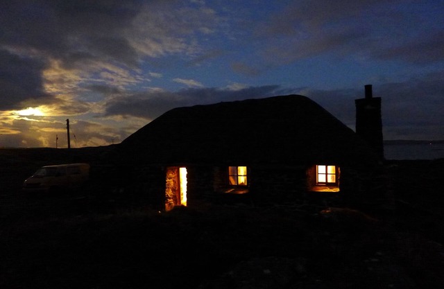 Traditional stone and thatch cottage on the waters edge with beautiful sea views