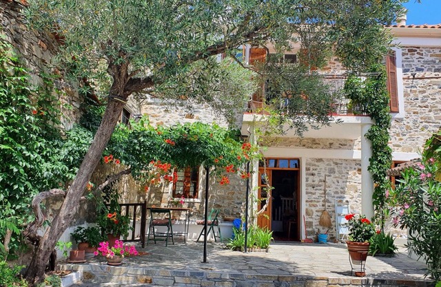 Traditional stone house with enclosed, idyllic courtyard, near the sea